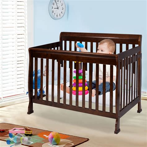 Wood crib. With gently tapered oak legs in a natural finish, the crib's tonal simplicity translates perfectly in a nursery, while the solid wood rails and spindles lend stability and timeless style that can be passed down through the years. GREENGUARD Gold Certification. Finn White Wood Convertible Baby Crib 54.13"Wx29.88"Dx36"H. 