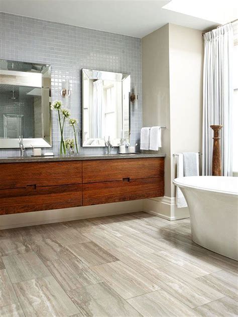 Wood floor bathroom. When it comes to installation, laminate flooring wins over tiles. Laminate flooring (made from wood and resin) is very easy to install and clip-together ... 