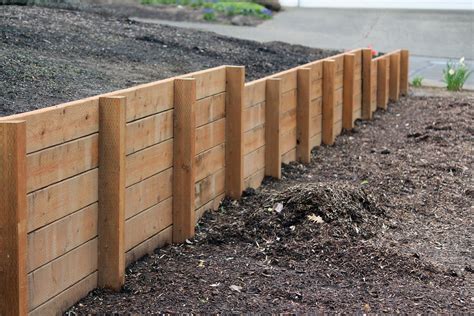 Wood retaining wall. This DIY retaining wall Outdoor project is all about how to build a timber retaining wall from start to finish. This DIY timber retaining wall shows the ste... 