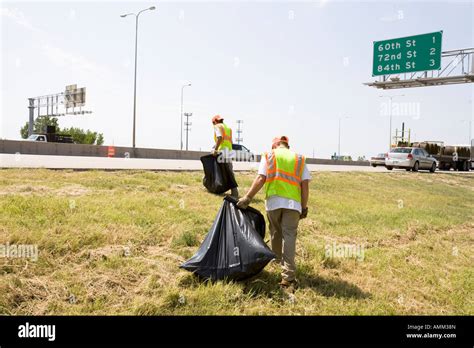 Work release inmates working with picking up trash on the side of the