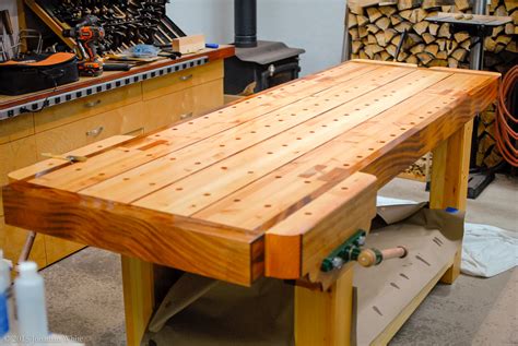 Workbench top. Clamp together the stretchers and legs. Predrill and bolt the base together. Pro tip: Keep the width of the legs from outer edge to outer edge at exactly 16-1/2 inches. Use this base as a large sawhorse to assemble the top of this 2×4 workbench. Step 2. 