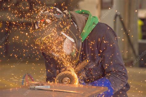 Worker grinding material Stock Image C057/5410 Science Photo Library