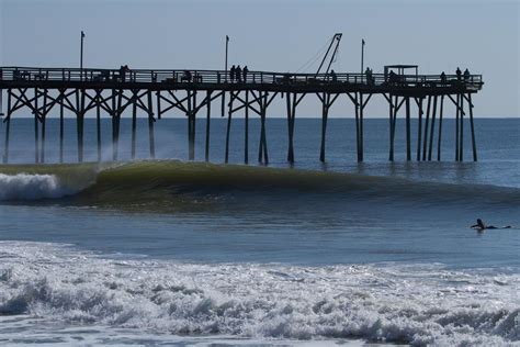 One local's account of North Carolina police cracking down on surfers at Wrightsville Beach Pier; surfers riding waves too close to Johnny Mercer Pier. 