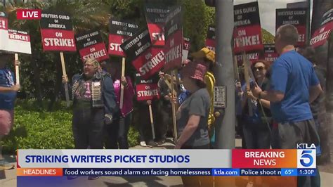 Writers picket Warner Brothers, Disney, CBS and more as strike begins