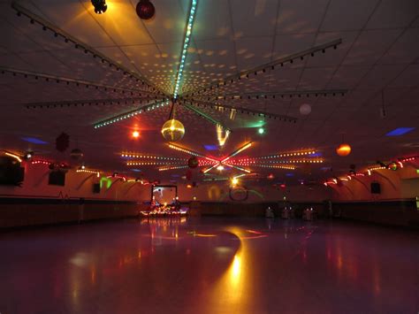 Andrew Scott throws a die in the air while leading a game for skaters at Skateland on Saturday, May 13, 2023, in Union Gap, Wash. Skateland celebrates its 75th anniversary. 