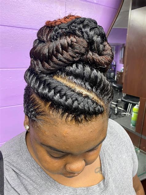 Braided Hot Air Balloon. Janet Jackson’s hair (literally) reached new heights with this epic top knot that features a braided cornrow base. There’s so much to love about this look, including ....