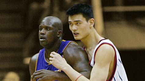 Yao ming next to shaq
