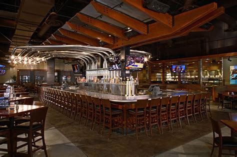 Yard house waikiki. Yard house is located on Lewers street and I usually end up parking at the Fort Derussy parking lot. Their happy hour is M-F 2pm - 530pm and also Sunday-Wednesday 1030pm - Closing. They have cheap drinks and select appetizers and pizzas are half off. 