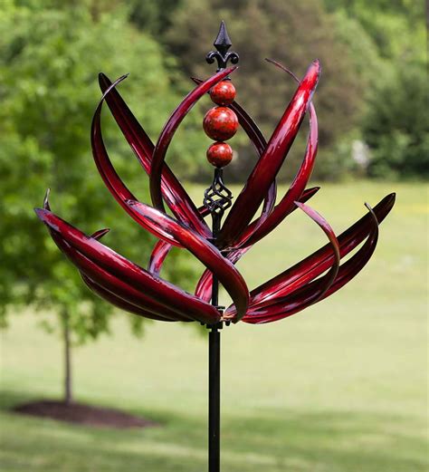 Transform your flowerbed from classic to creative by placing this Red Kinetic Stratus Vertical Wind Spinner in it. Installing a wind sculpture in your yard ...