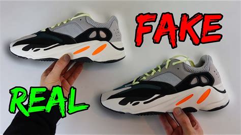 Yeezy 700 real vs fake. The nubuck overlay’s hole is wider on the Fake Adidas Yeezy Wave Runner , see yellow circle. the placement of the perforations on the back panel is higher on the fakes-( the gap between the the first perforation and the edge of the midsole is higher on the fake pair). 