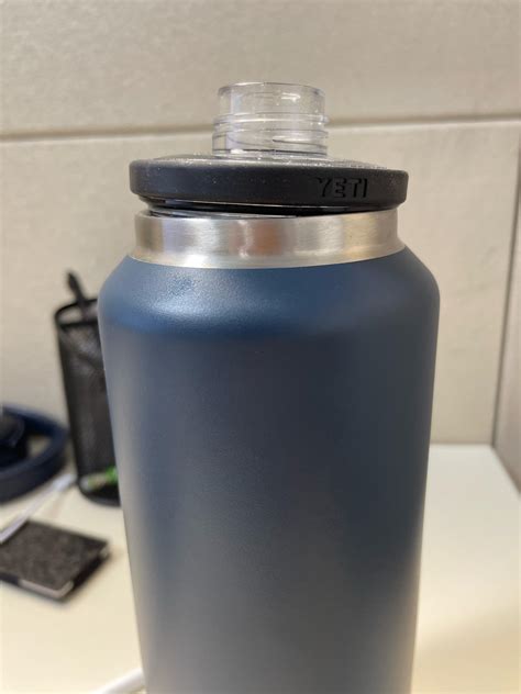 Place the lid of your yeti water bottle inside the gripping mechani