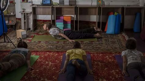 Yoga in a basement helps people in a Ukrainian front-line city cope with Russia’s constant shelling