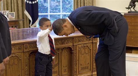 Young Boy Touches Barack Obama