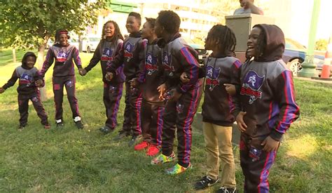 Youth football team and mother rally around wounded coach