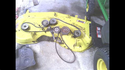 Replacing a spindle on a John Deere z445 mower. Includes showing how to remove the deck, spindle, and reinstall both including the blade.