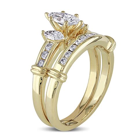 Honor her with this shimmering diamond engagement ring. Crafted in warm 14K gold, this elegant design features a sparkling 1/4 ct. marquise-shaped diamond center stone wrapped in a swirl of diamond-lined ribbons. Radiant with 1/2 ct. t.w. of diamonds and a brilliant buffed luster, this engagement ring dazzles and delights the one you love.. 