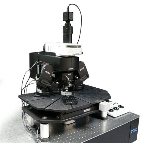 A compact adaptive optics module corrects aberrations in two-pho