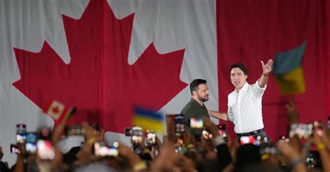 Zelenskyy, accompanied by Trudeau, greets cheering crowd of supporters in Toronto