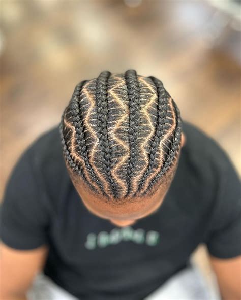 Zig zag braids men. Zig Zag Braids. If you’re looking for an eye-catching pattern, zig zag braids can deliver the look you want. Like criss-cross designs, most zig zag cornrows start with a taper fade haircut on the sides and back. Artistic and charming, zig zag styles are often accomplished with smaller braiding for the cleanest finish. 