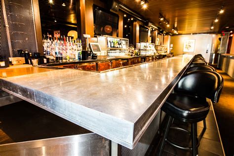 Zinc bar. A zinc bar is a type of bar top or counter made of zinc or pewter, often found in cheap or low-class establishments. Learn about the origin, usage and meaning of this term in … 
