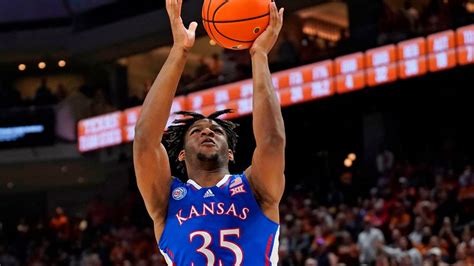 Kansas forward Zuby Ejiofor throws down a dunk in front of Indiana for