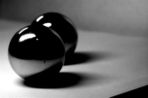 a black object is standing on a white surface and it appears to be in
