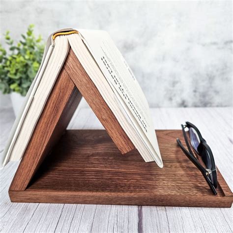 A Book Is At Rest On A Tabletop