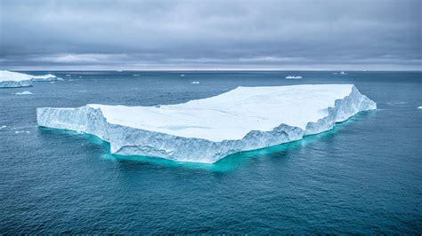 A Floating Ice Block Is Pushed Through A Displacement
