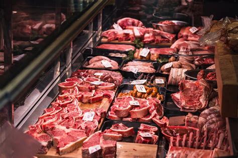 A Meat Stall With The Holy Family Giving Alms
