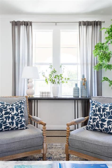 a table with pictures on it in front of a window