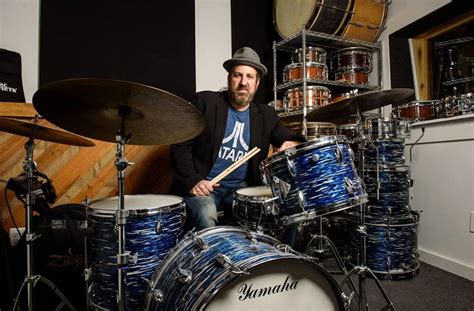 aaron comess biography