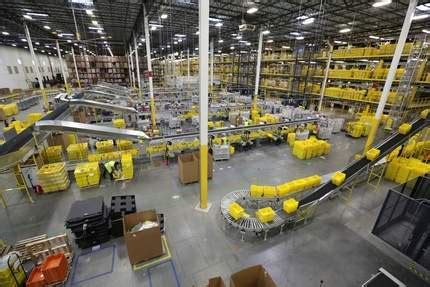 At a fulfillment center in Kent, Wash., an Amazon employee shows 
