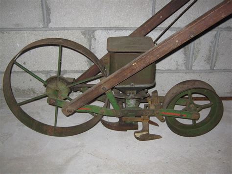 Antique Push Seeder