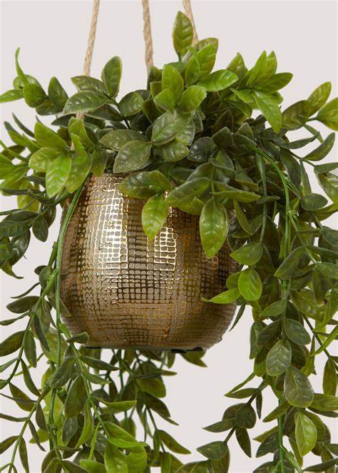 artificial plant in gold pot
