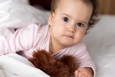 Authentic Portrait Cute Caucasian Little Infant Chubby Baby Girl Or Boy In Pink Sleep With Teddy Bear On White Bed  Child Resting At Lunchtime  Care Stock Photo - Babe Togel