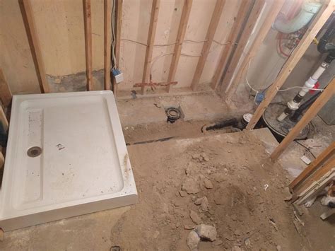 bathroom - How do I pour concrete over basement plumbing?