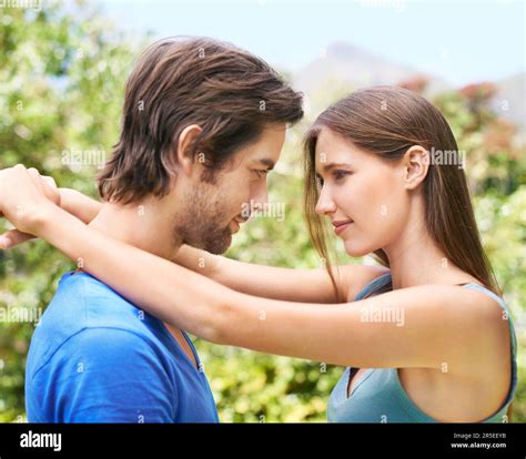 Boyfriend Wrapping Arms Around Girlfriend's Legs