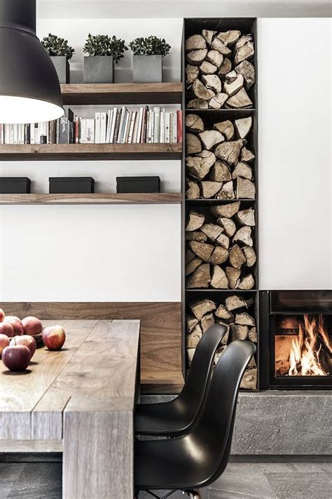 built in firewood storage next to fireplace