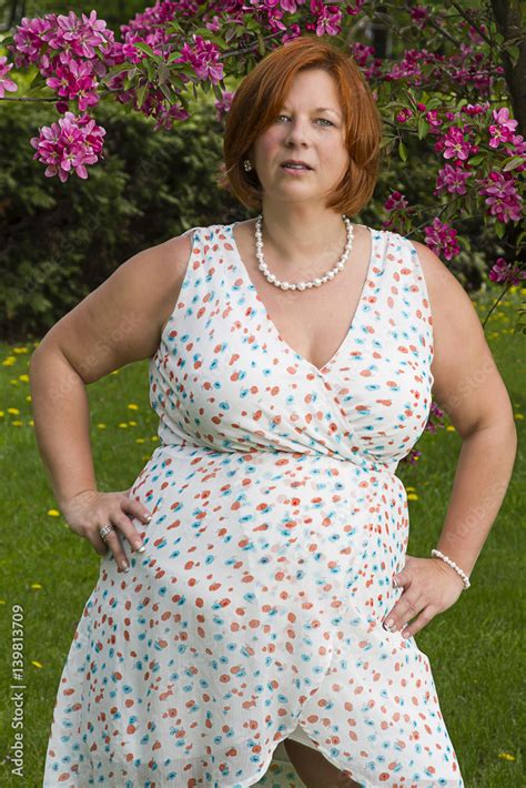 Plus Size Fat Mature Woman Wearing Bra, On White. Stock Photo