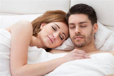 couple sleeping nude