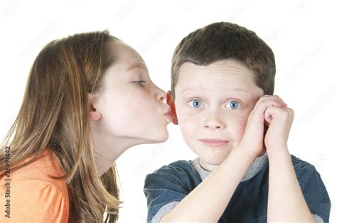 girl kiss a boy on cheek