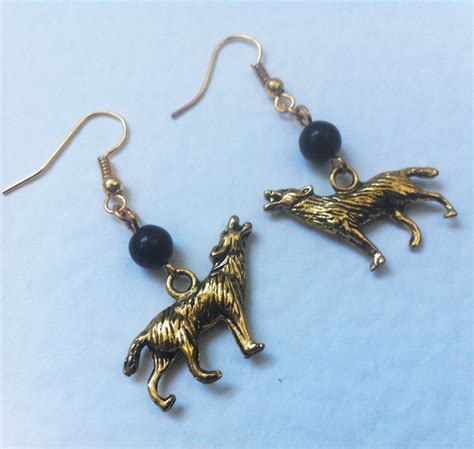 gold wolf earrings