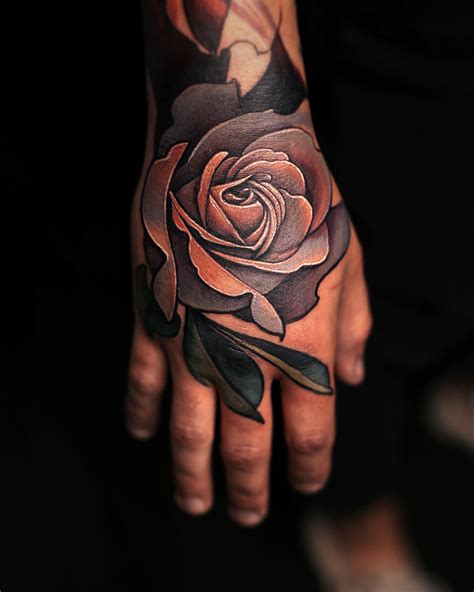 hand with rose tattoo