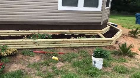 How To Build A Flower Bed Out Of Landscape Timbers?