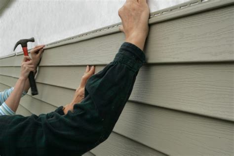 how is vinyl siding attached