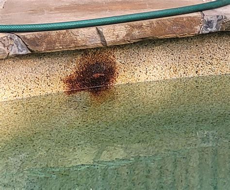 how to remove rust stains from pool liner