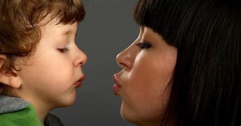 is kissing your parents on the lips weird