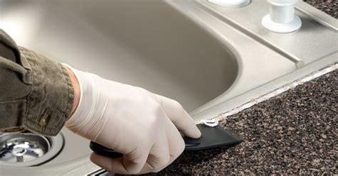 kitchen sink leaking around edges