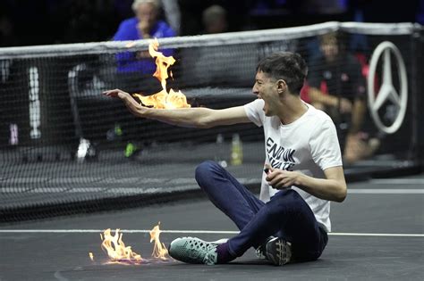 Laver Cup protester delays match after setting arm, court on fire