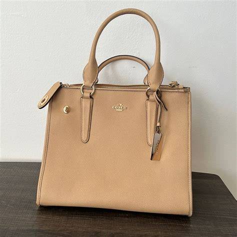 nude coach purse